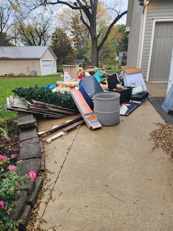 Dumpster being loaded with debris for Residential Dumpster Rental in Berrien